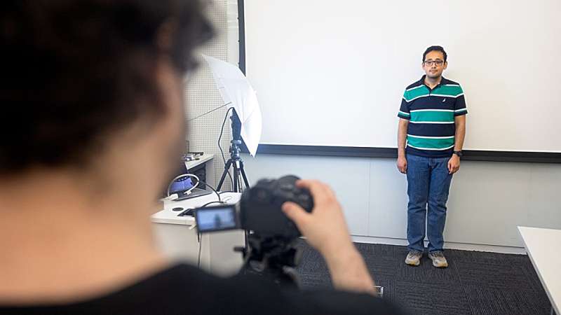 Davis and Michael at work in Davis’ Gates Hall lab. Credit: Sreang Hok/Cornell University Hiding secret codes in light can protect against fake videos