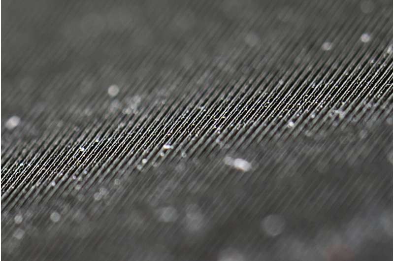 Etched energy: A close-up of laser-etched nanostructures on the surface of a solar thermoelectric generator. Credit: University of Rochester / J. Adam Fenster Black metal could give a heavy boost to solar power generation